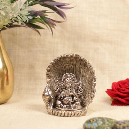 Metal Ganesha Sitting on Nag Singhasan